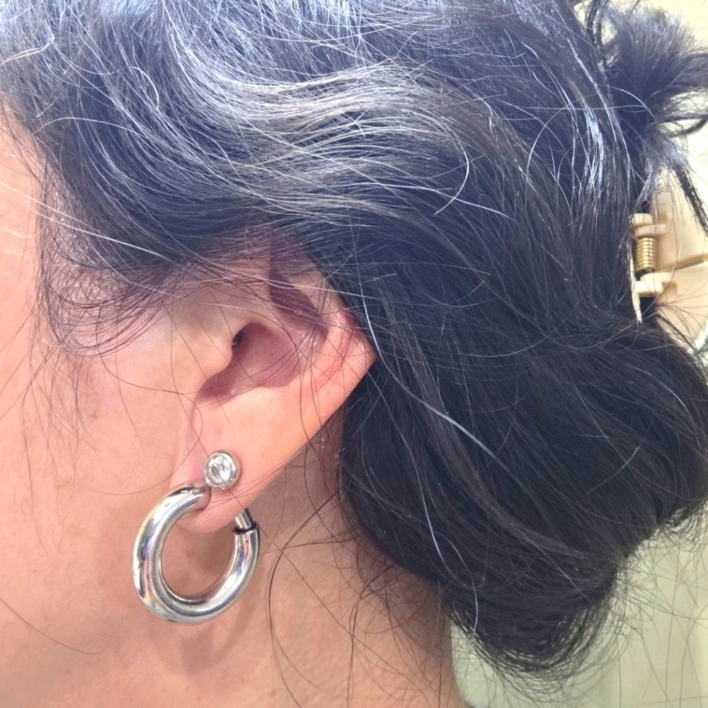 Silver toned puffy hoop huggie clip on retractable comfort Earrings